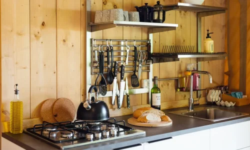 Interior of safari lodge with kitchen, living space and modern comforts in Somerset glamping