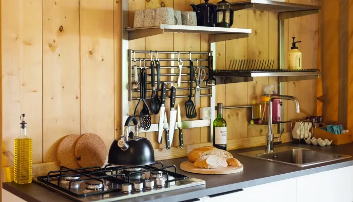 Kitchen and dining area inside Grisway Lodge safari tent in Somerset