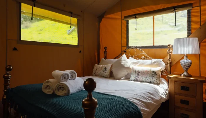 Double bedroom inside Lime Kiln Lodge safari lodge in Somerset