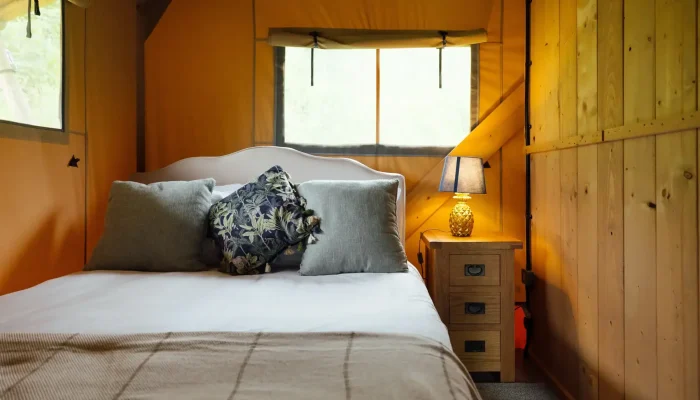 Double bedroom inside Horsecombe Lodge safari lodge in Somerset