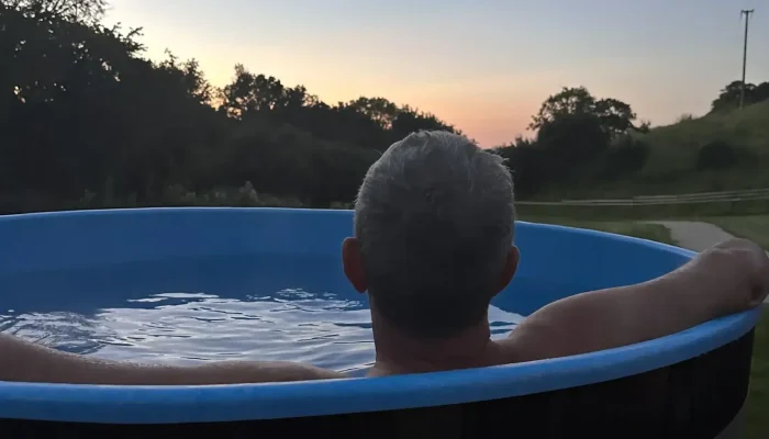 Wood-fired hot tub outside Lime Kiln Lodge in Somerset countryside